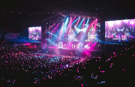 Colorful live concert with vibrant lighting, energetic crowd, and dynamic stage performance.